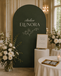 Atelier Elunora event display with floral arrangements, signage and photo magnets