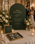 Atelier Elunora wedding photo magnet display with olive signage, flowers and candles